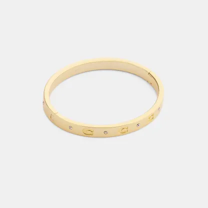 COACH®,Repeated C Hinged Bangle,Cubic Zirconia,Glass,Gem Embellishment,Logo,Stackable,Brass Gold,Casual,Clear,Front View