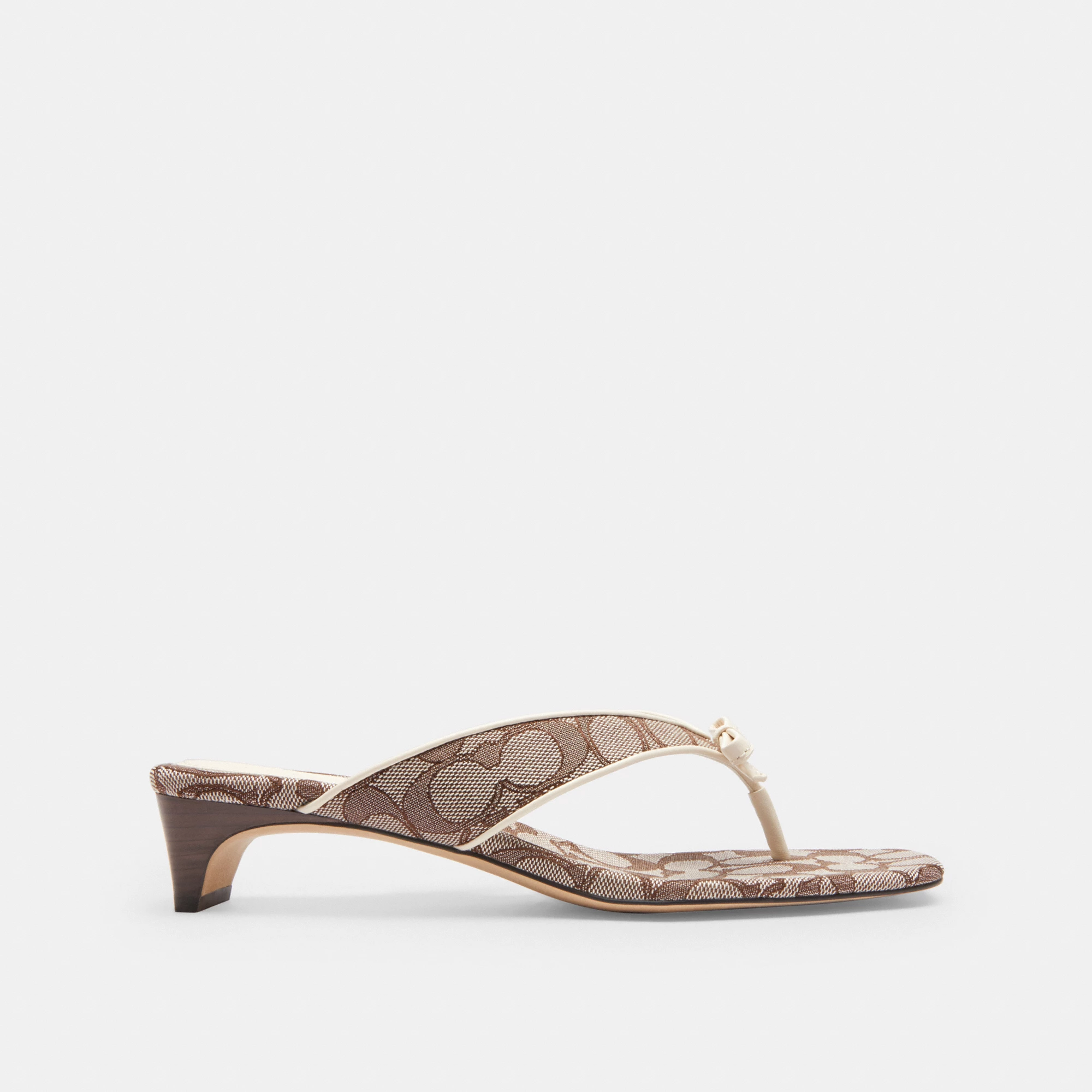 COACH®,Bow Thong Kitten Heel In Signature Jacquard,Brown,Angle View