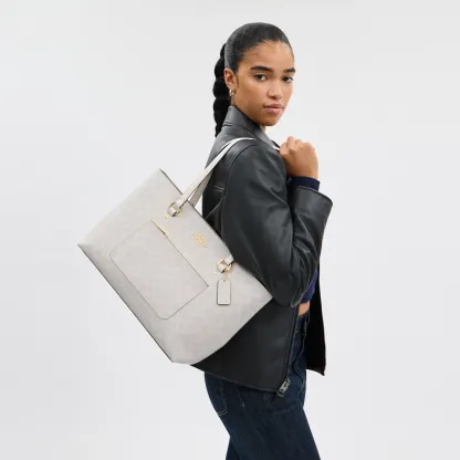 COACH®,Station Tote Bag In Signature Canvas,Canvas,Fabric,Mixed Media,Leather,Tote,Logo,Pattern,Luggage Tag,Lined,Silver M...,Multi Color,Detail View