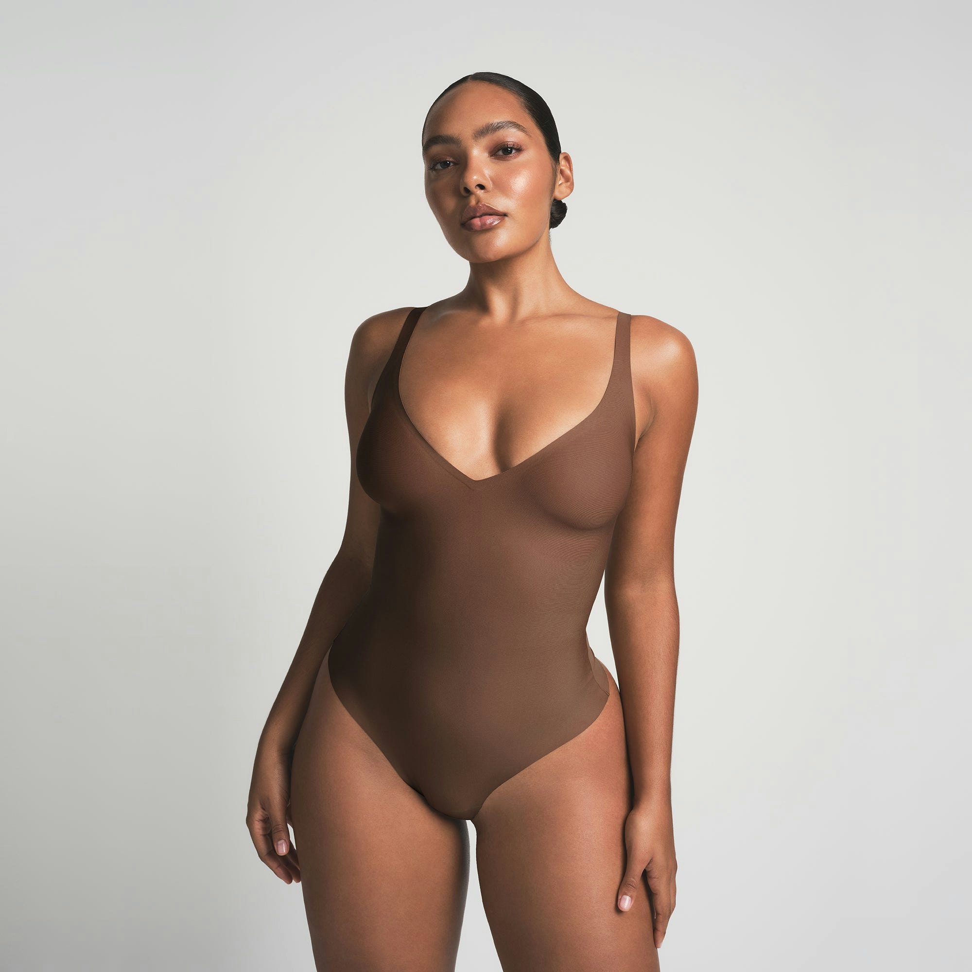 SKIMS BODY UNLINED PLUNGE THONG BODYSUIT - JASPER