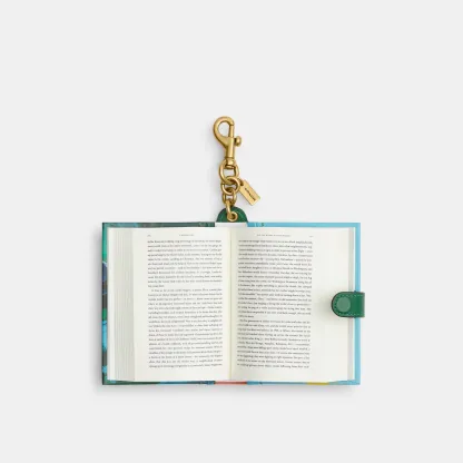 COACH®,Little Fires Everywhere By Celeste Ng Book Bag Charm,Bag Charm,Metal Material,3D Embellishment,Color Block,Logo,Multi Color,Inside View,Top View