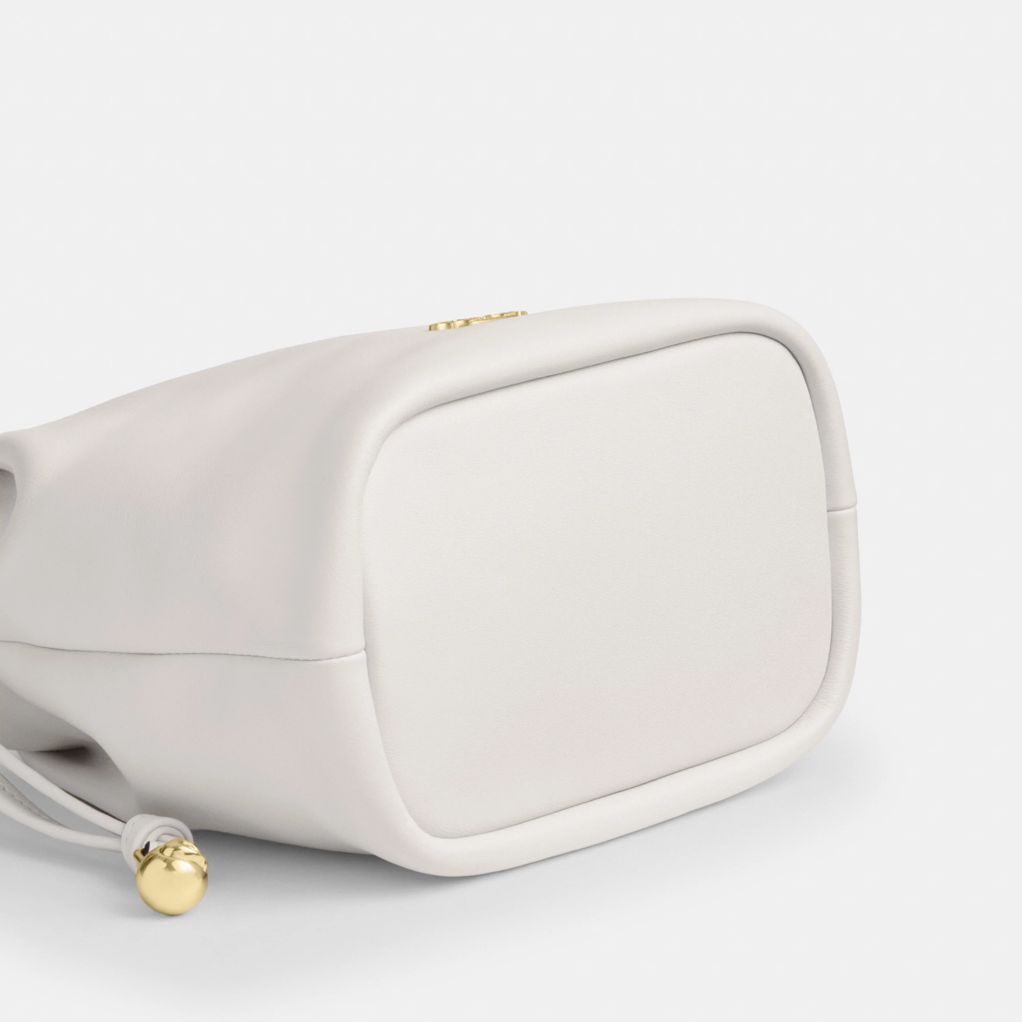 COACH®,Faye Mini Drawstring Bag,Leather,Bucket,Logo,Metal,Silver Metal,Day Party,White,Outsole View
