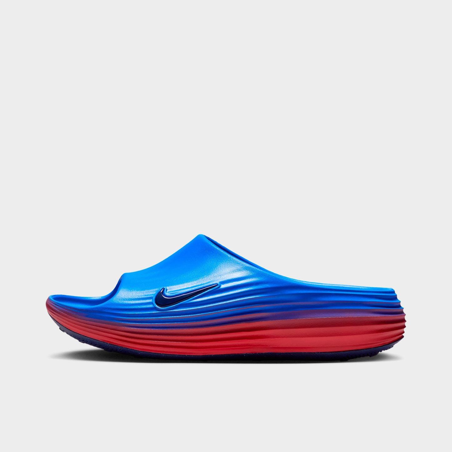 Women's Nithtke ReactX Rejuven8 Slide Sandals - Action Red/Light Photo Blue/Midnight Navy/Midnight Navy - Left shoe facing left. Outside of the shoe.