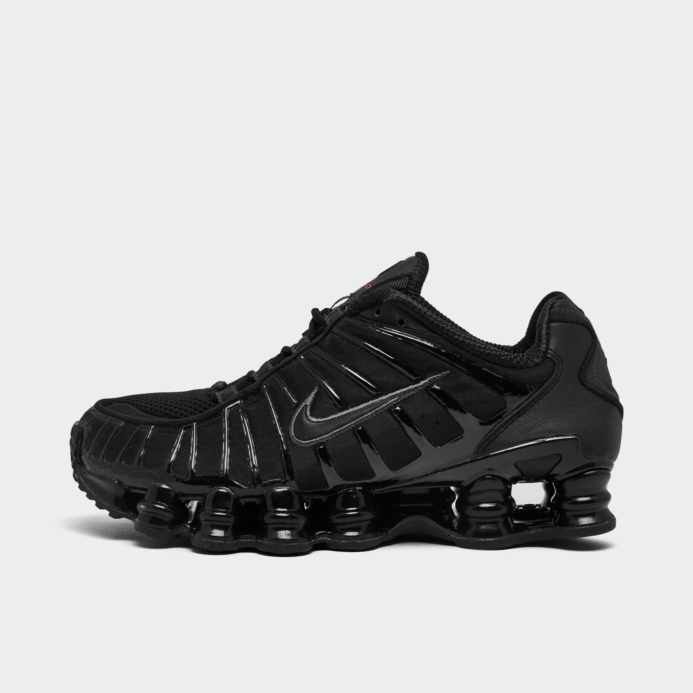 Women's Nithtke Shox TL Casual Shoes - Black/Black/Metallic Hematite/Max Orange - Left shoe facing left. Outside of the shoe.