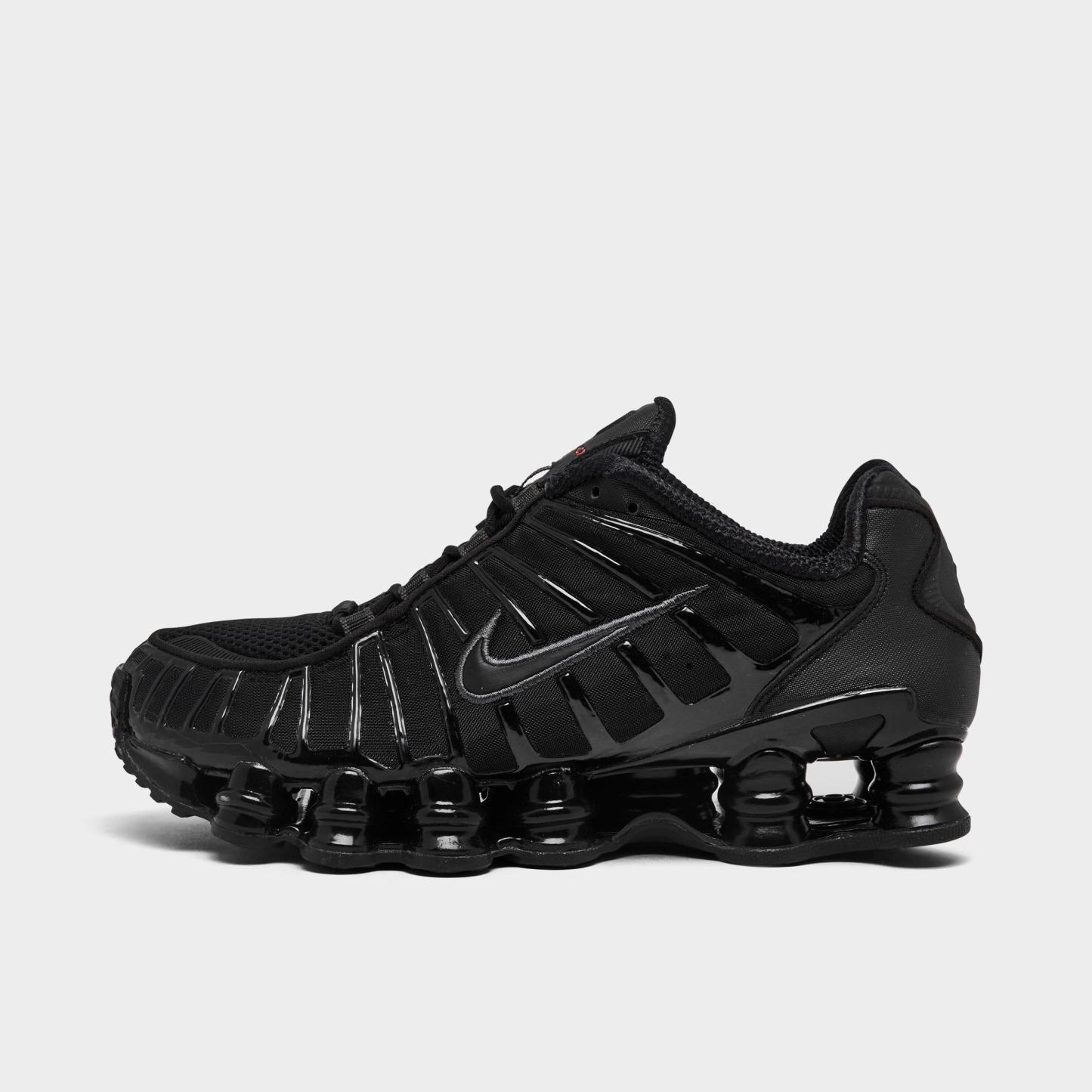 Women's Nithtke Shox TL Casual Shoes - Black/Black/Metallic Hematite/Max Orange - Left shoe facing left. Outside of the shoe.