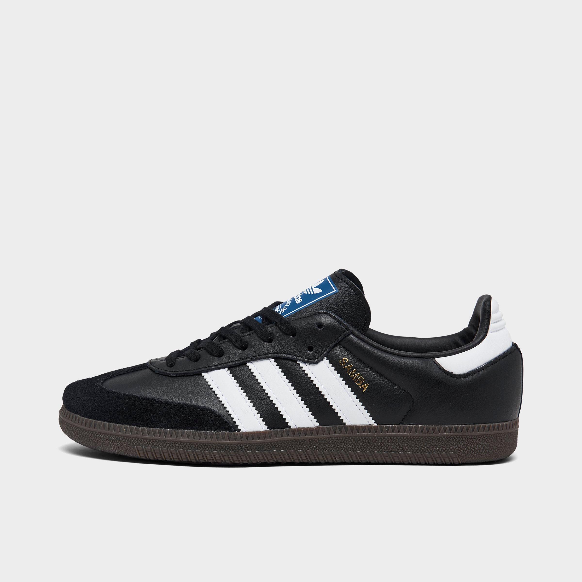 Big Kids' adidas Originals Samba OG Casual Shoes - Part 2 - Core Black/Footwear White/Gum - Left shoe facing left. Outside of the shoe.