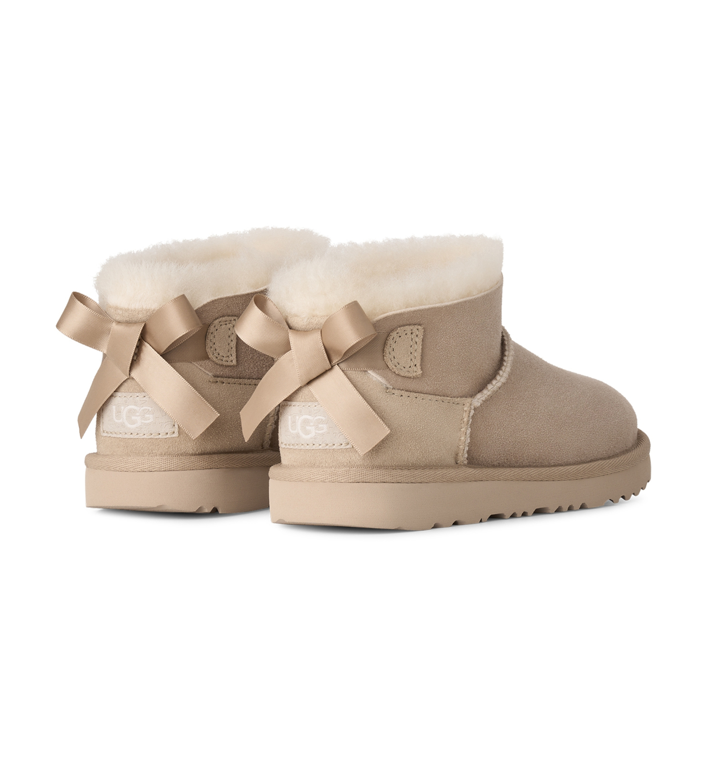 UGG® Kids Ultra Mini Bailey Bow Round Toe Booties - Sand