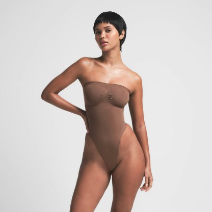 SEAMLESS SCULPT STRAPLESS THONG BODYSUIT - JASPER