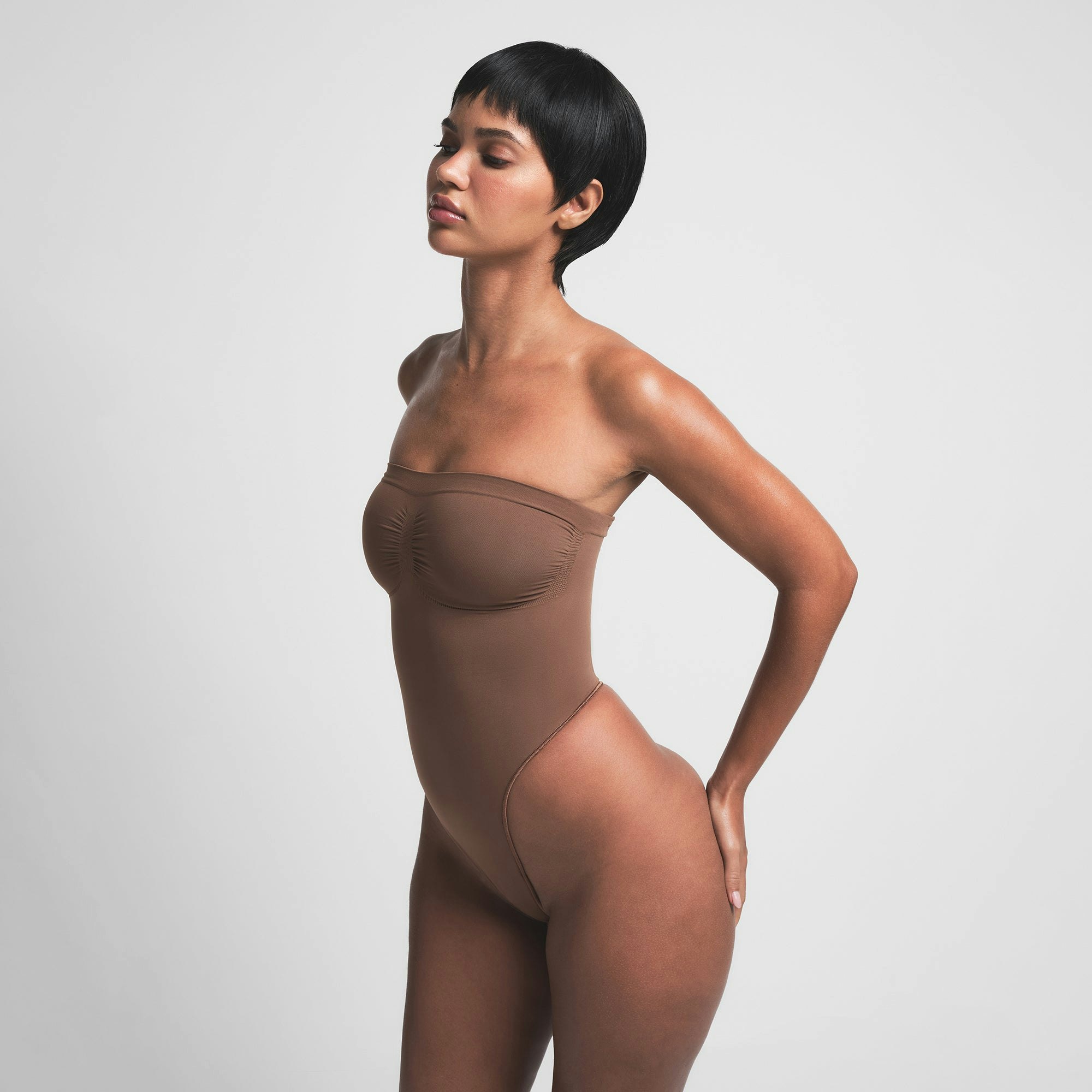 SEAMLESS SCULPT STRAPLESS THONG BODYSUIT - JASPER