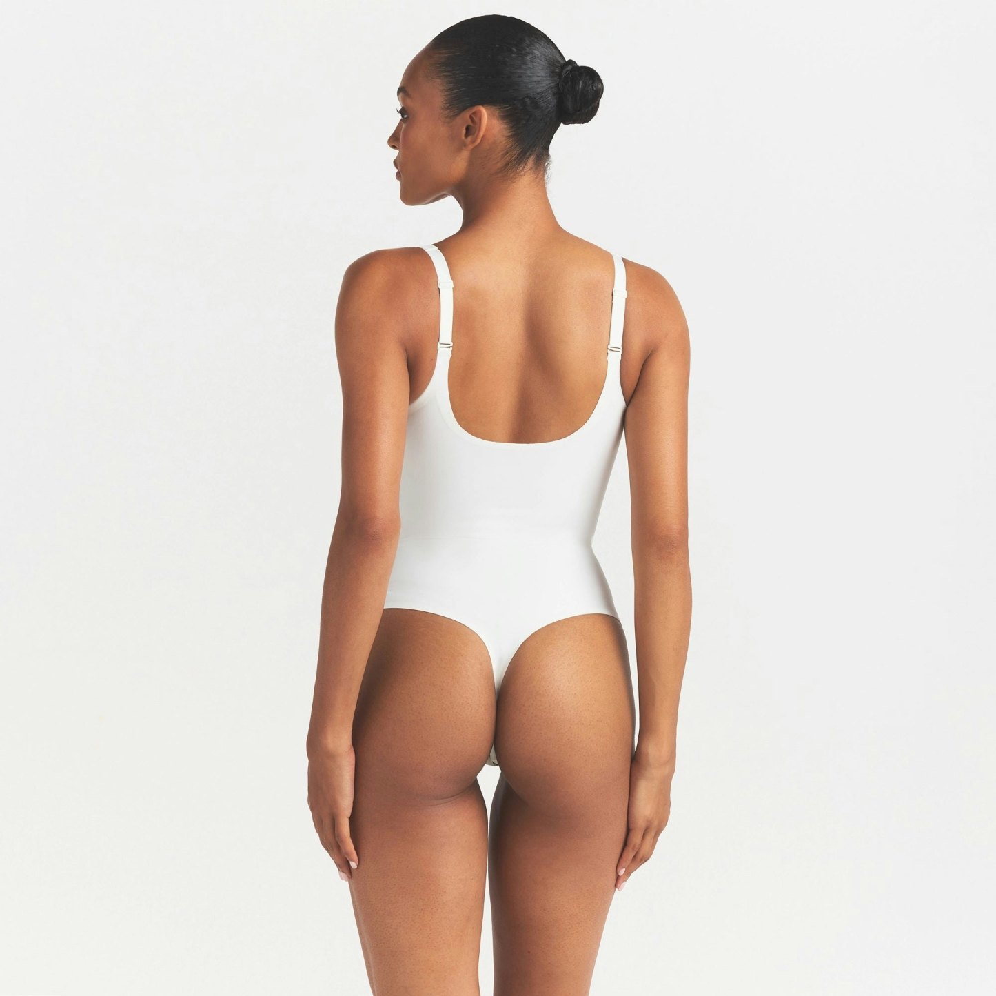 SKIMS BODY UNLINED PLUNGE THONG BODYSUIT - IVORY