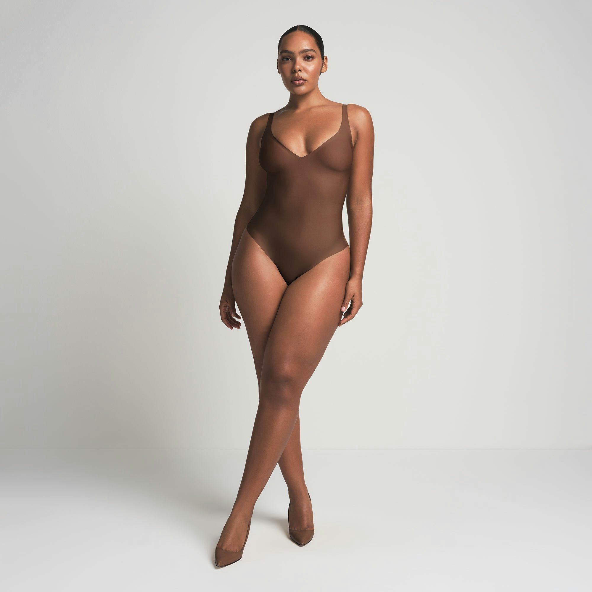 SKIMS BODY UNLINED PLUNGE THONG BODYSUIT - JASPER
