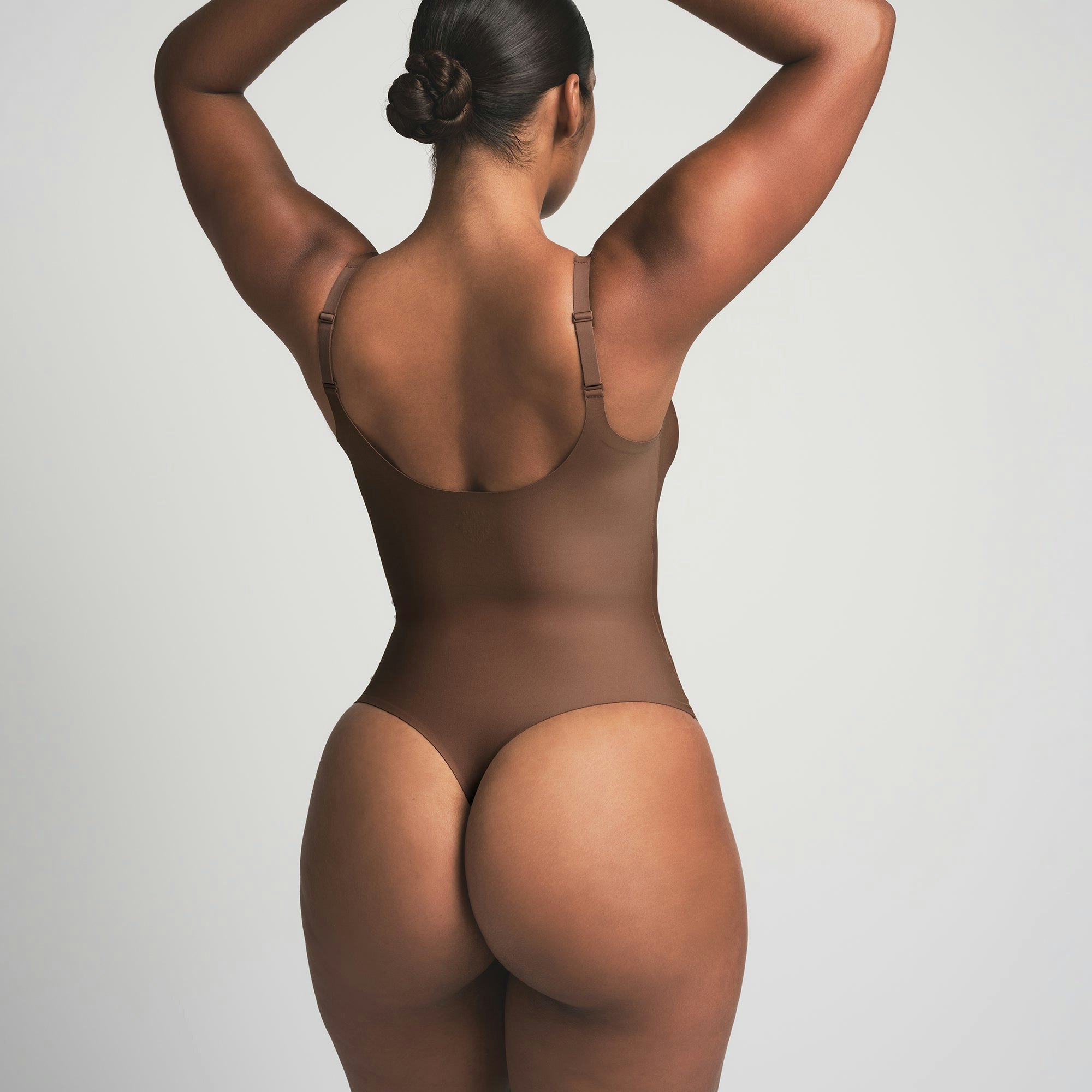 SKIMS BODY UNLINED PLUNGE THONG BODYSUIT - JASPER