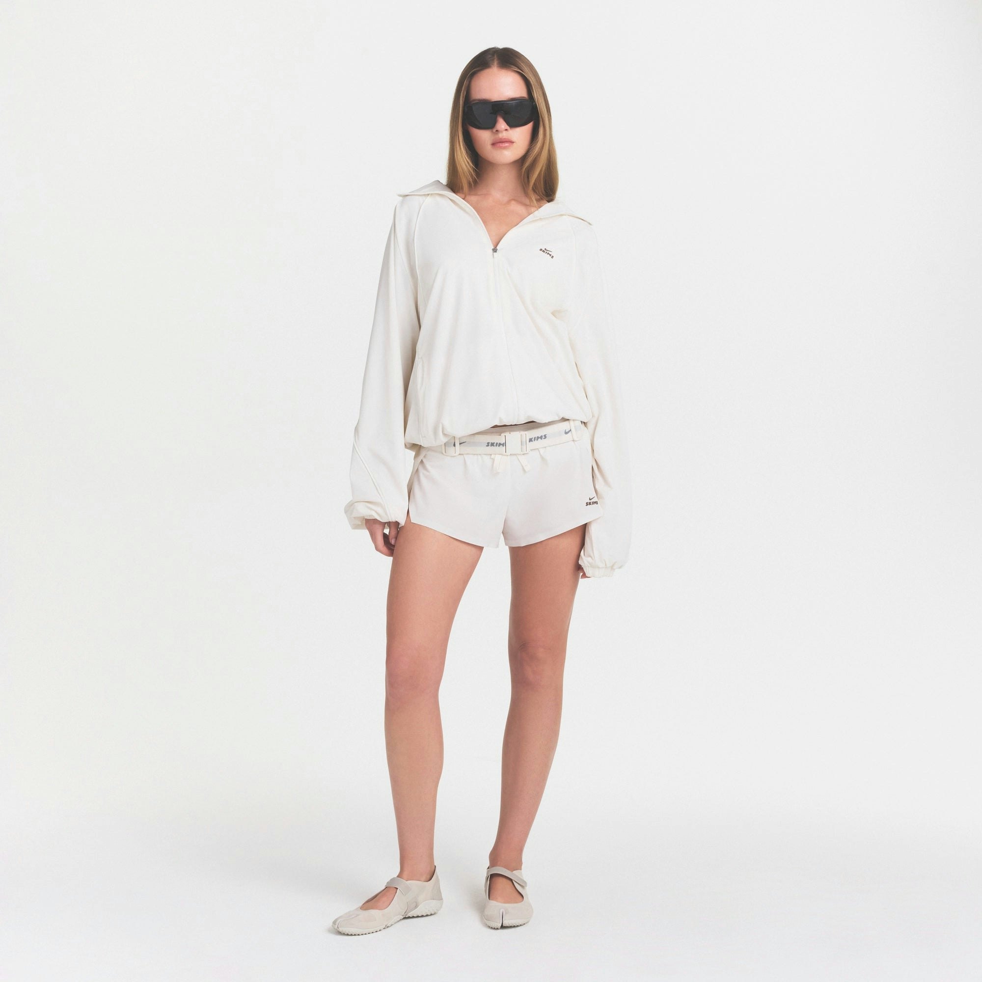 NikeSKIMS STRETCH NYLON OVERSIZED TRACK JACKET - IVORY