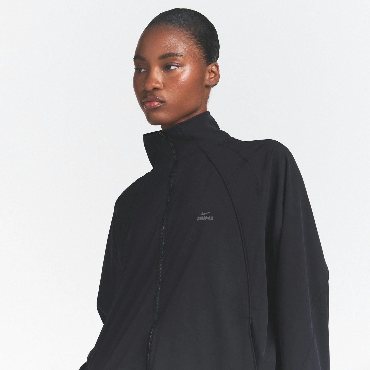 NikeSKIMS STRETCH NYLON OVERSIZED TRACK JACKET - OBSIDIAN - image 9