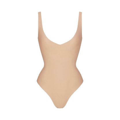 SKIMS BODY UNLINED PLUNGE THONG BODYSUIT - CLAY