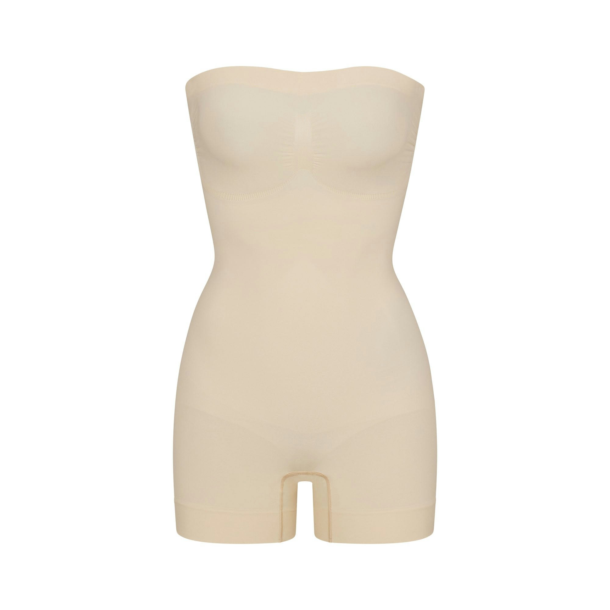 SEAMLESS SCULPT STRAPLESS SHORTIE BODYSUIT - SAND