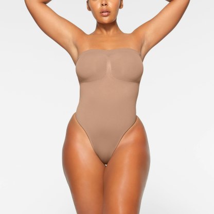 SEAMLESS SCULPT STRAPLESS THONG BODYSUIT - SIENNA
