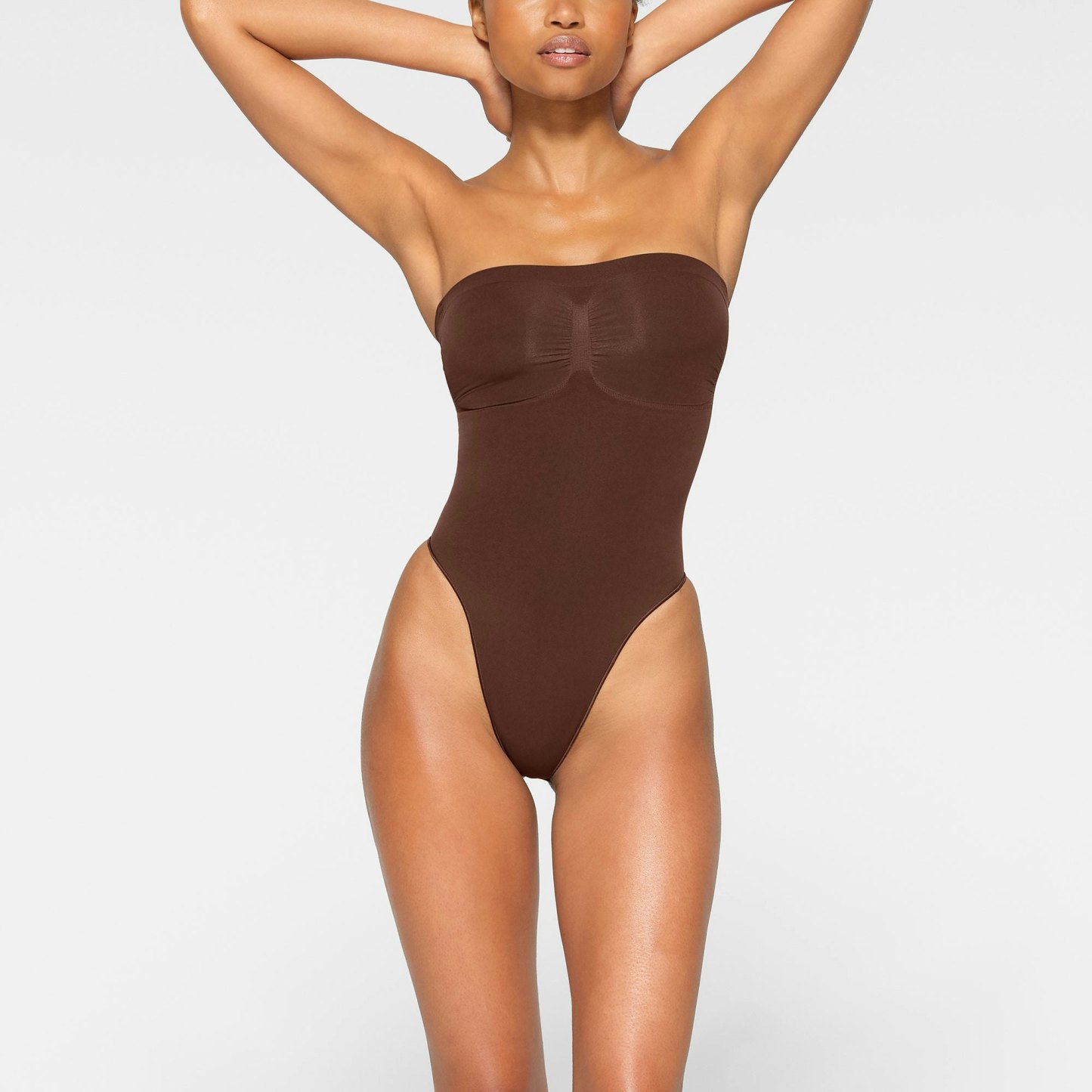 SEAMLESS SCULPT STRAPLESS THONG BODYSUIT - COCOA