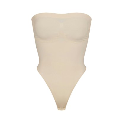 SEAMLESS SCULPT STRAPLESS THONG BODYSUIT - SAND