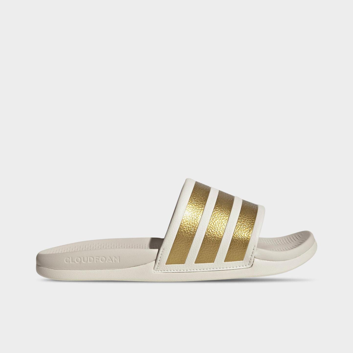 Women's adidas Adilette Comfort 2.0 Slide Sandals - Off White/Gold Metallic/Chalk White - Left shoe facing left. Outside of the shoe.