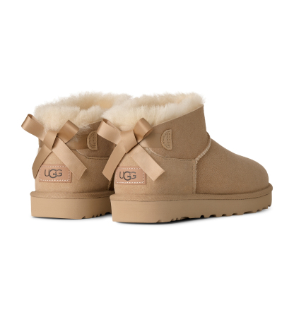 UGG® Women's Ultra Mini Bailey Bow Round Toe Booties - Sand