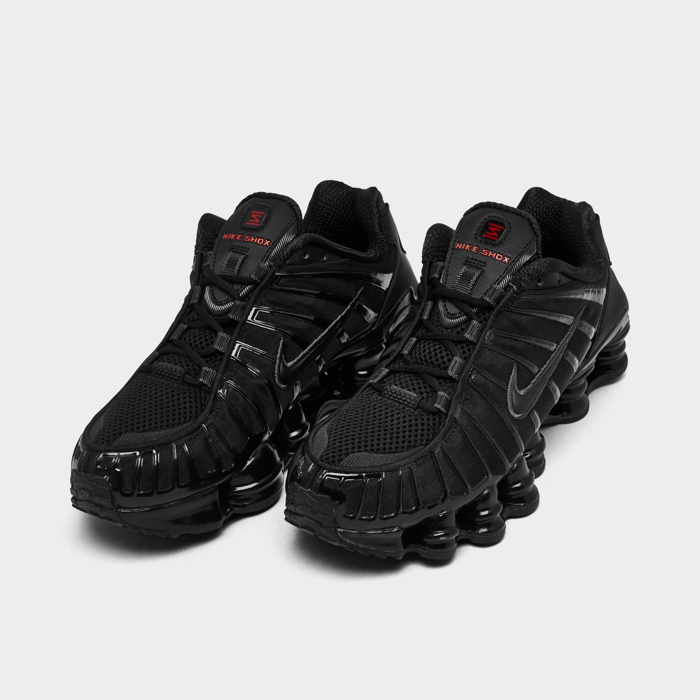 Women's Nithtke Shox TL Casual Shoes - Black/Black/Metallic Hematite/Max Orange - Both shoes facing left