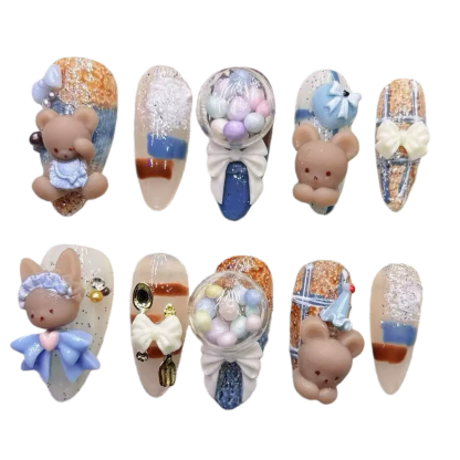 alt="Blue and nude 3D teddy bear and bunny press on nails with bows and candy balloon designs"