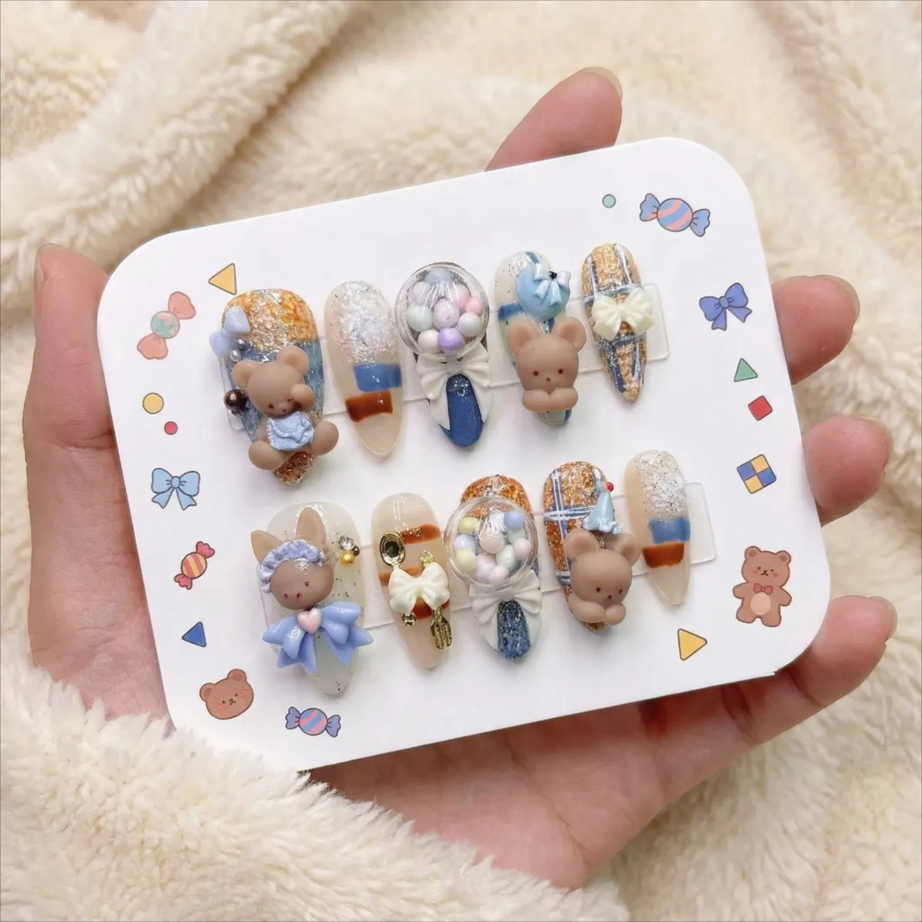 alt="Cute packaging card with blue and nude 3D teddy bear and bunny press on nails set"