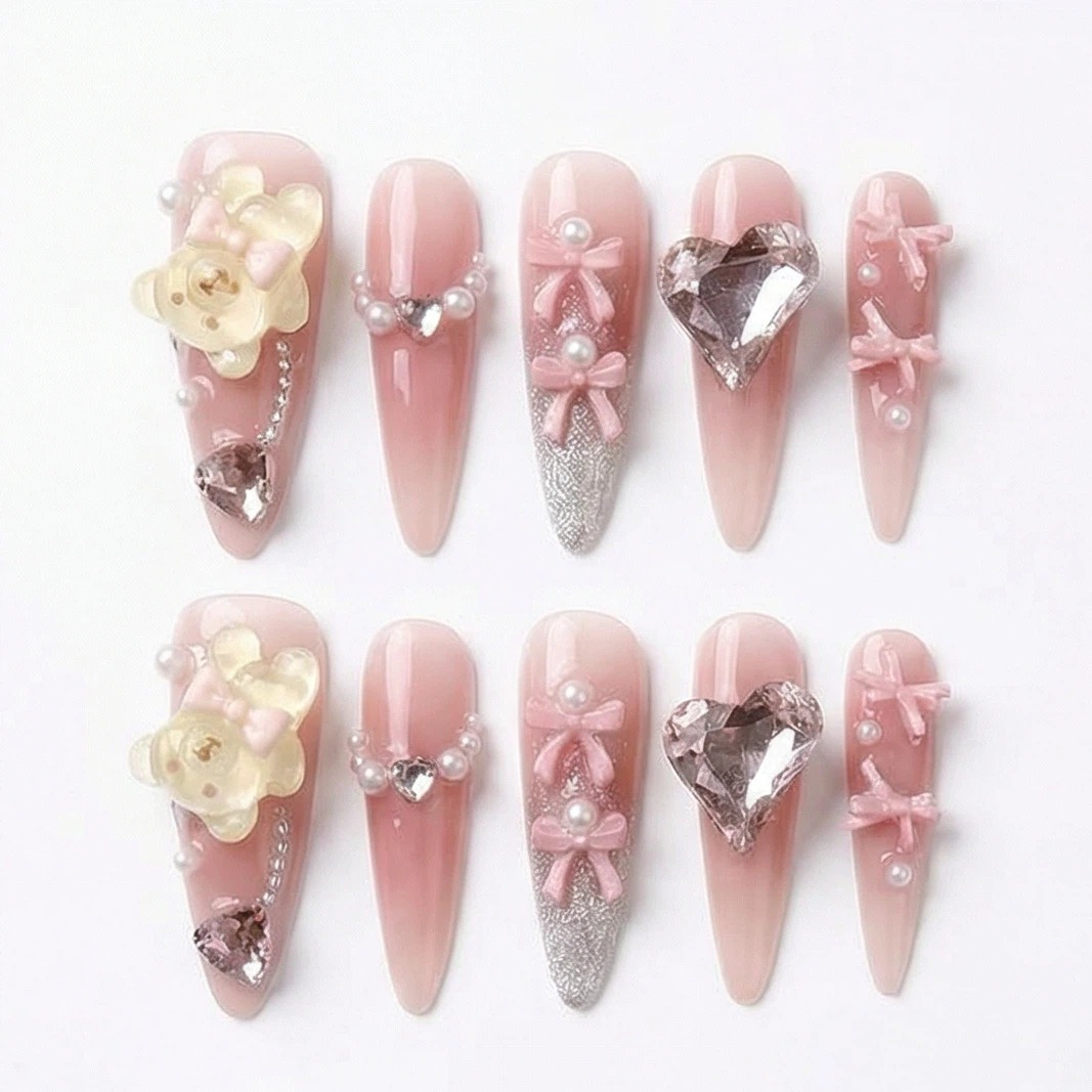 Blush pink embellished press on nails set with 3D flowers and bow charms, size options shown