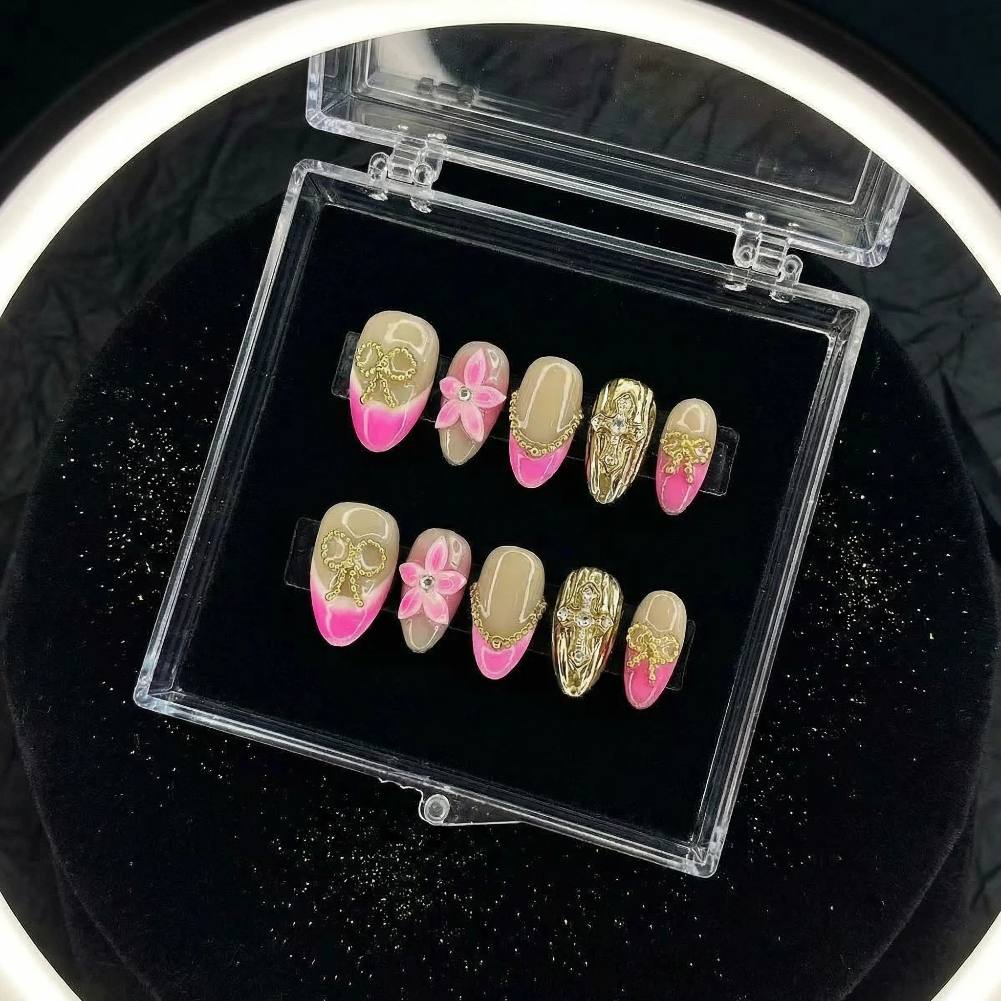 Press-on nails in clear storage case, rose champagne nude base with pink tips and gold accents