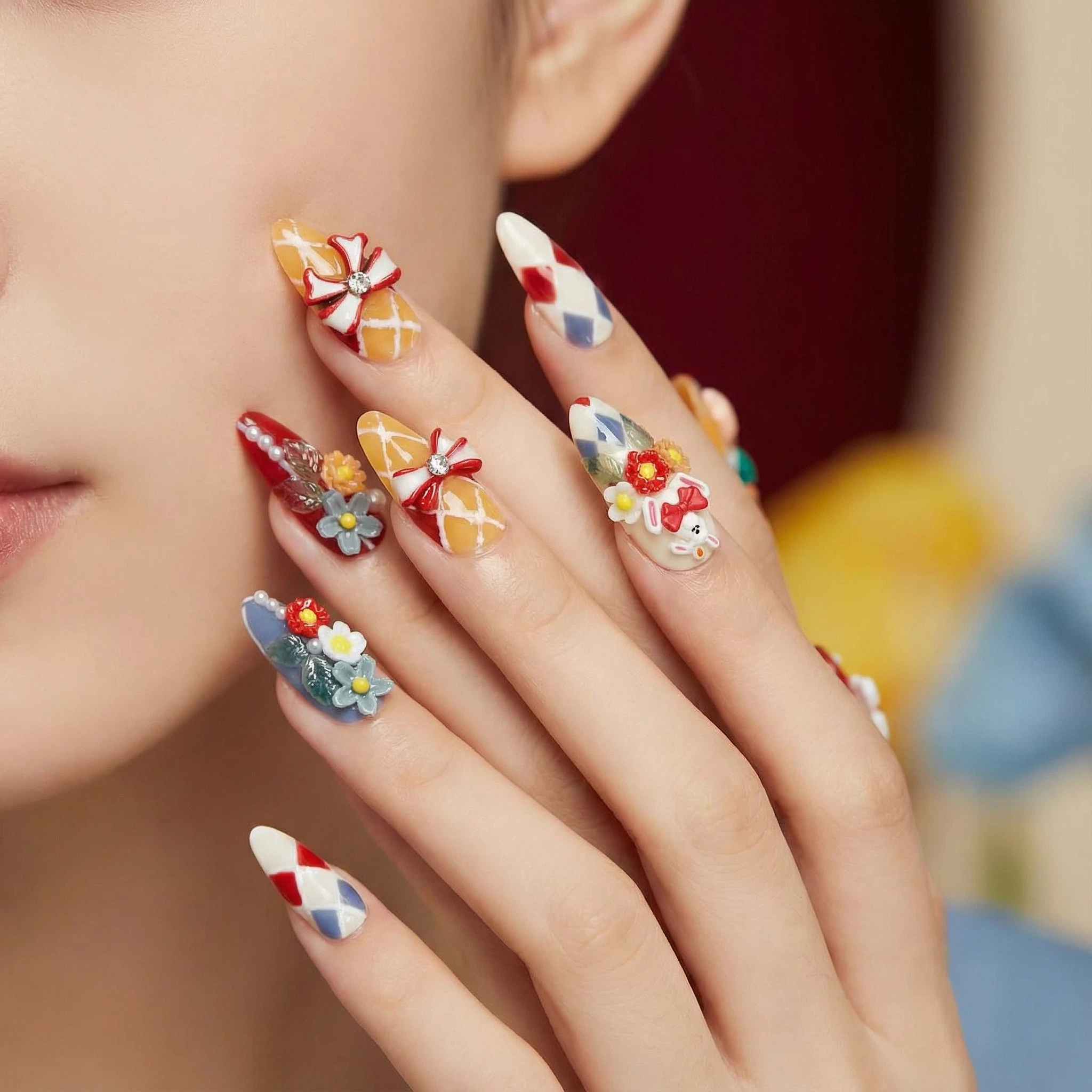 Model wearing colorful harlequin press-on nails with 3D flowers and bow accents