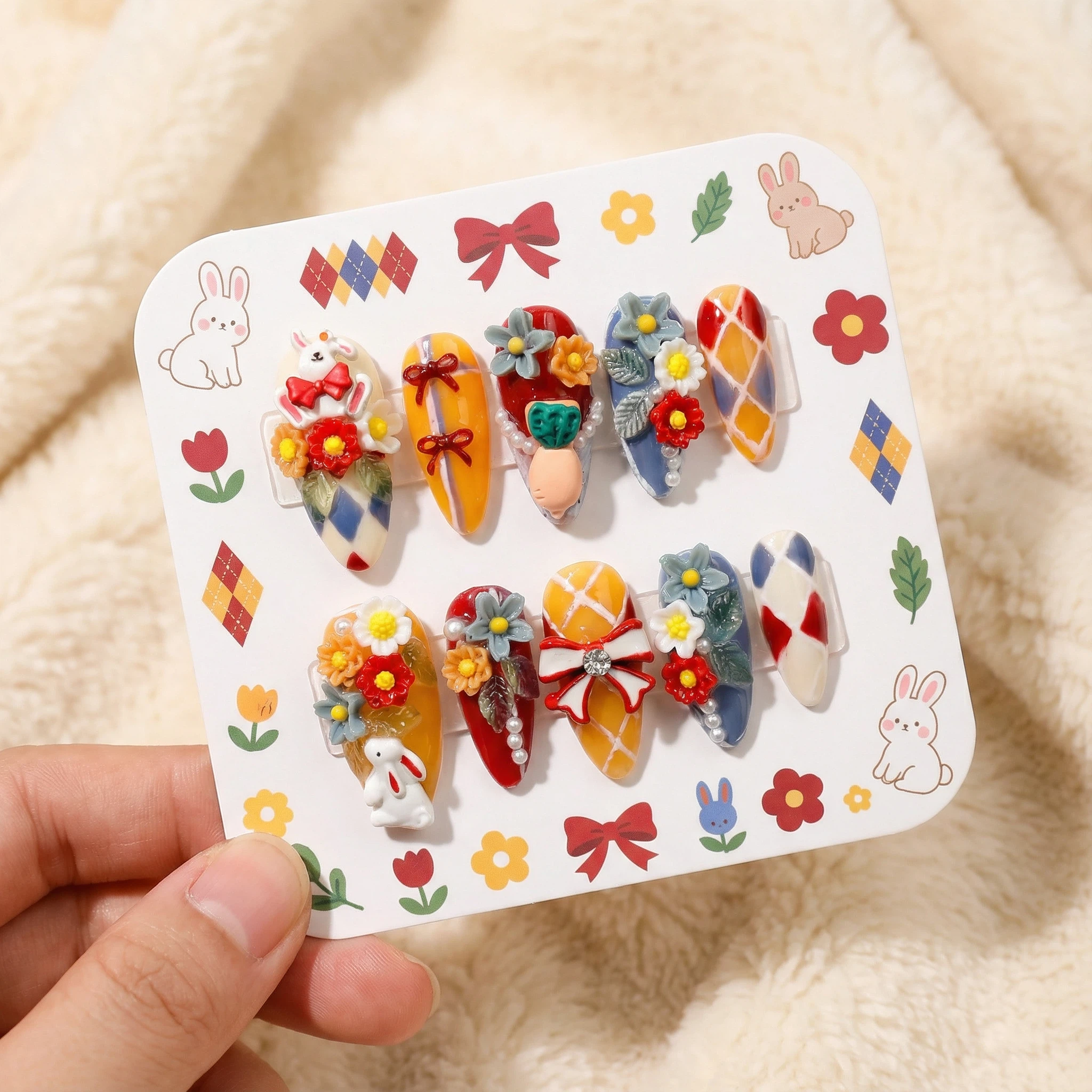 Colorful 3D floral press-on nails set on display card, red blue yellow harlequin design