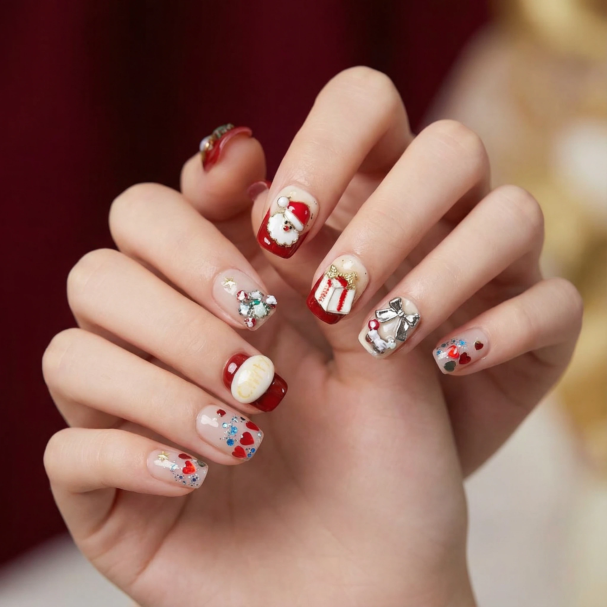 Red and white Christmas press-on nails on hands, festive holiday manicure with Santa-inspired accents