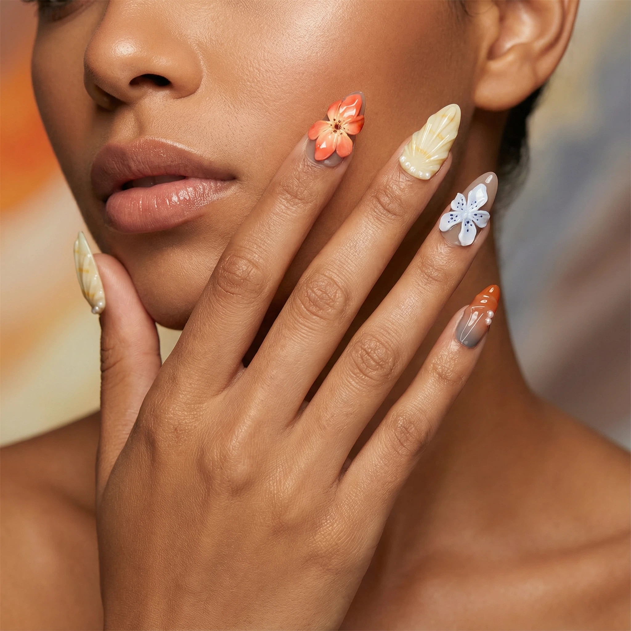 Reusable press-on nails close-up — autumn-inspired floral nails in warm neutrals with glossy finish and raised flower details.