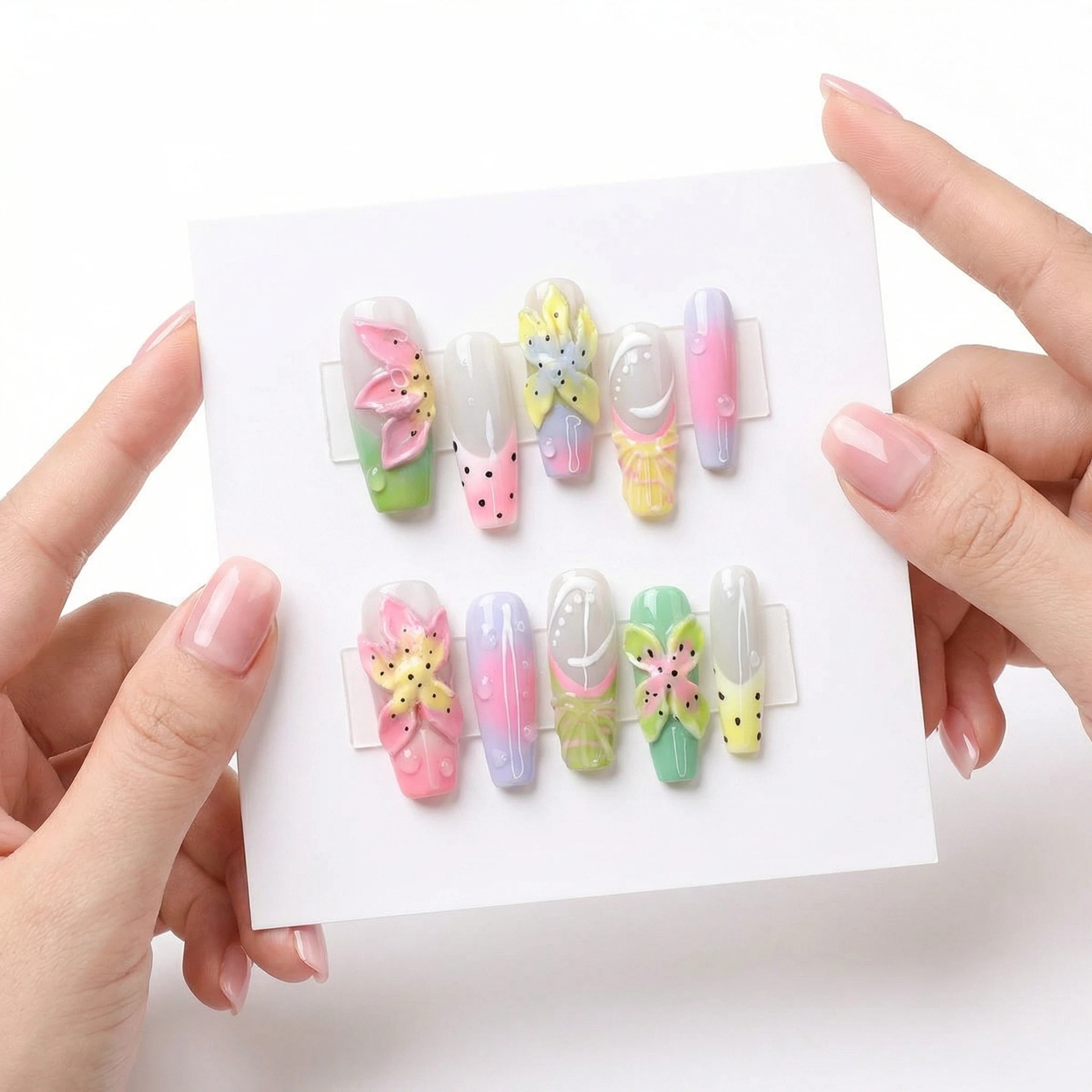 Pastel floral press-on nails set in pink purple yellow green gradient with 3D flower accents