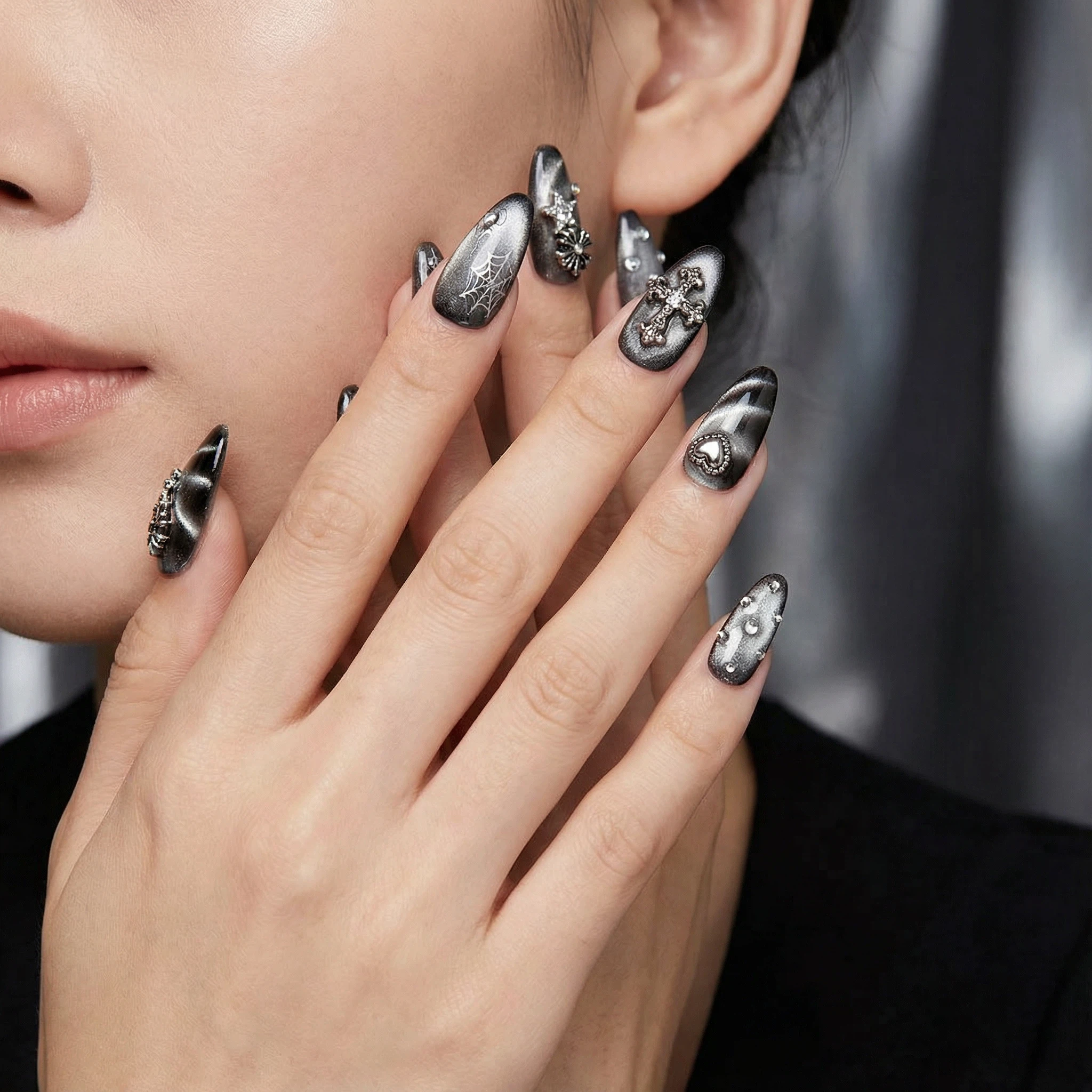 Smoky black-to-silver press-on nails with rhinestones, night-out manicure look