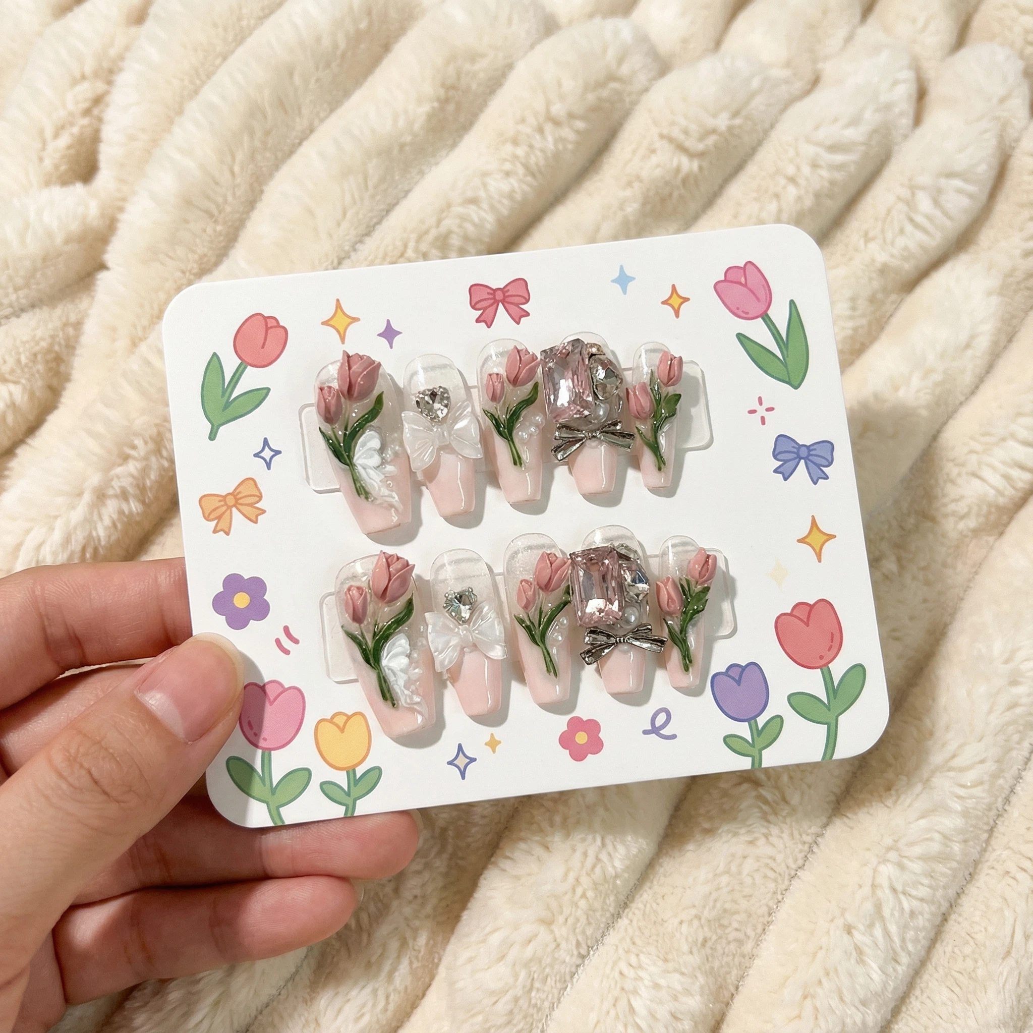 Green & pink rose press-on nails set on display card, glossy floral design with rhinestone accents