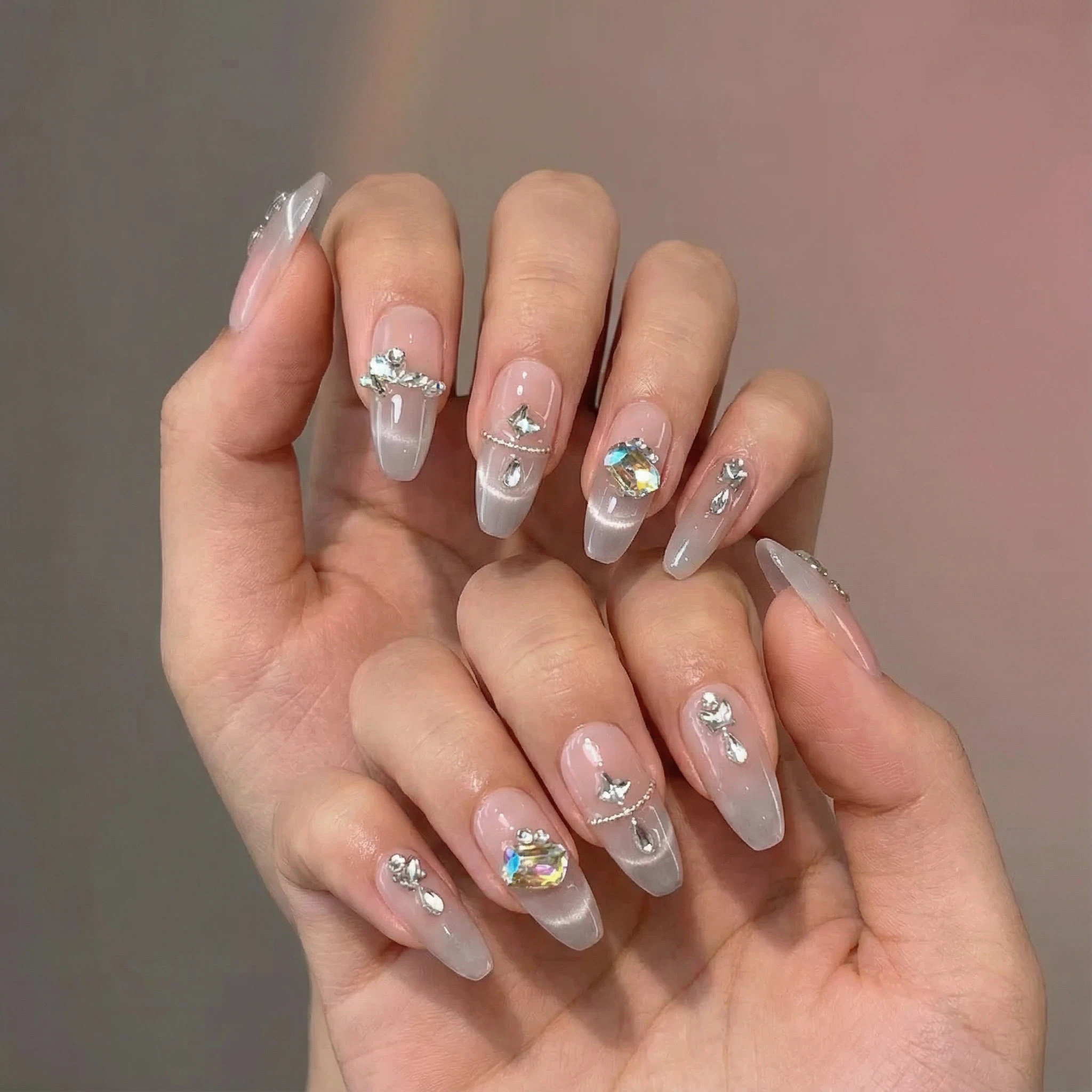 Elegant nude pink ombré press-on nails with rhinestones and pearls, salon-gloss finish