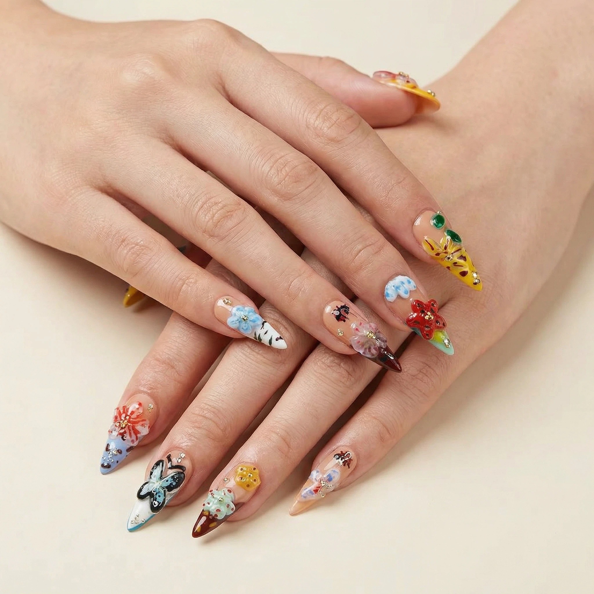 Wear shot 1： Hands wearing colorful mixed-design press-on nails with butterfly and flower details, glossy finish