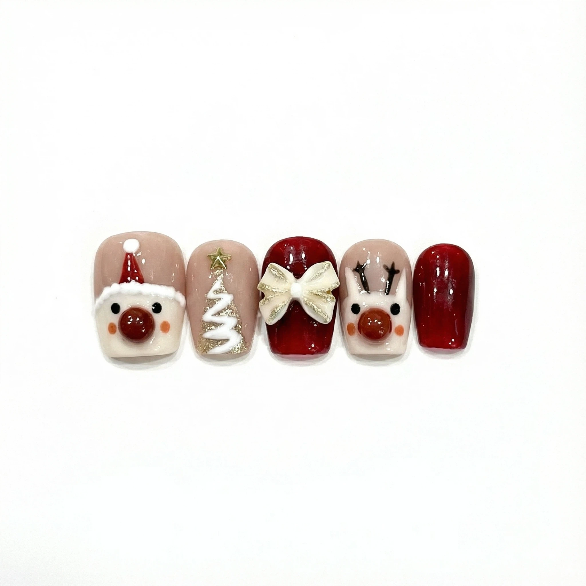Row of five red and nude Christmas press on nails showing Santa, tree, bow and reindeer details on short square tips