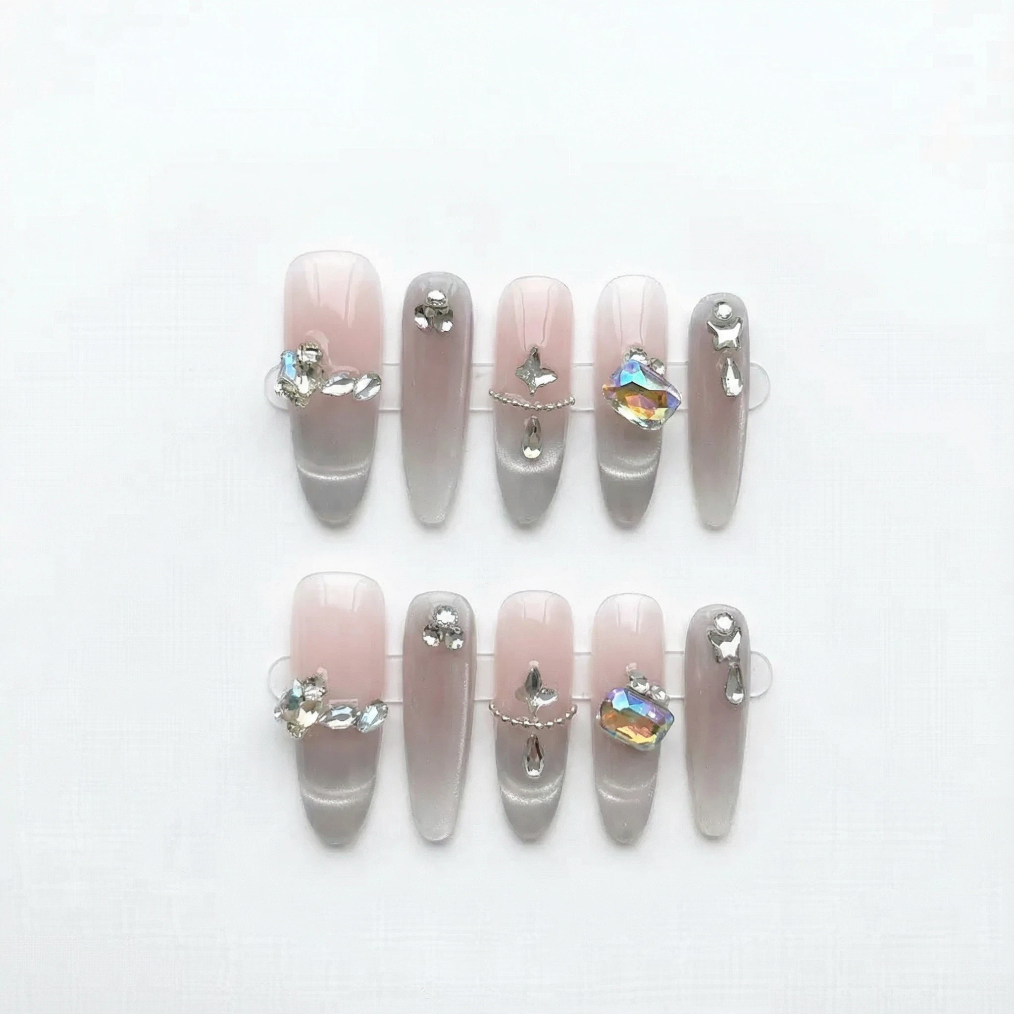 10-piece nude pink silver ombré press-on nail set with pearls and rhinestones, reusable kit