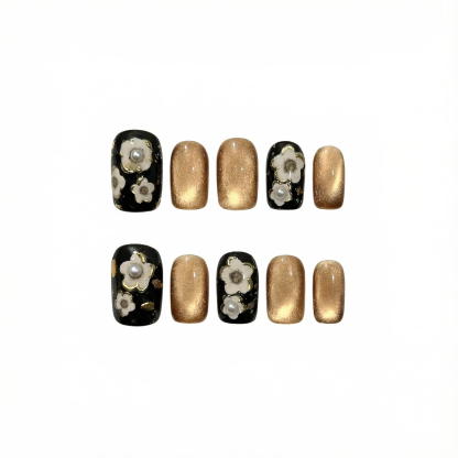 Short square black and gold press-on nails with flower and pearl accent layout