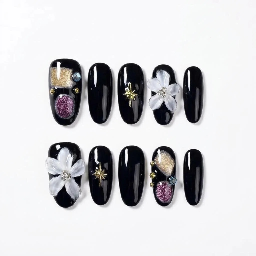 Press-on nails in sizes S and M laid out on a white background, black glossy set with bow and checkerboard accents.
