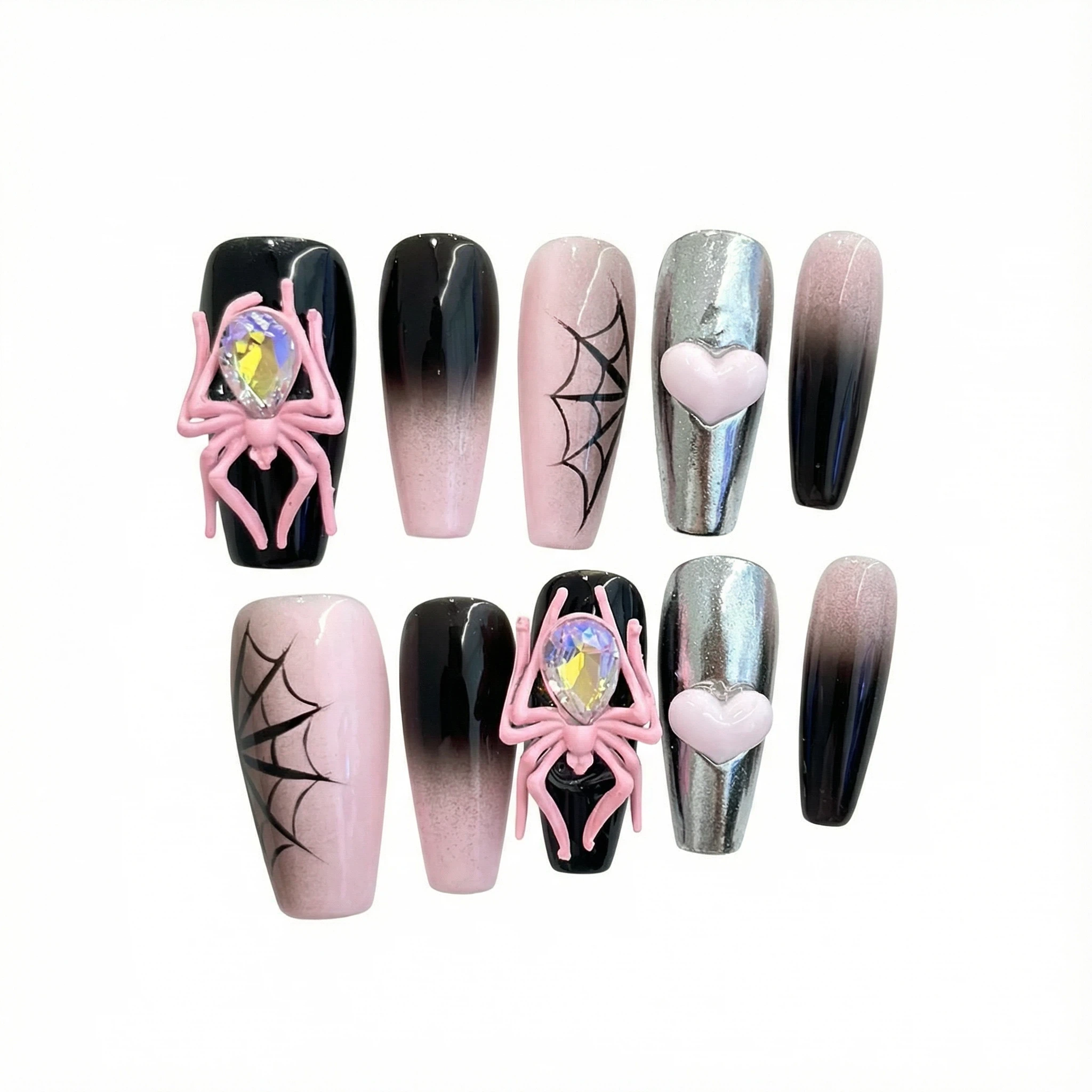 alt="Flat lay of long coffin pink spider web press on nails with black ombre, 3D spider and chrome heart accents"