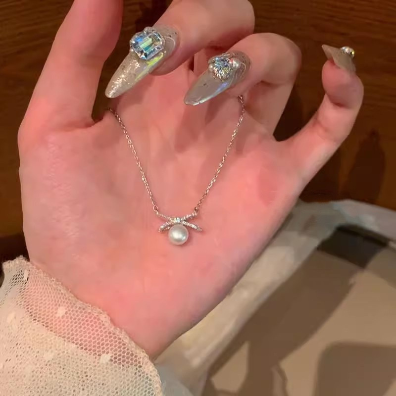 Silver Bow Faux Pearl Pendant Necklace