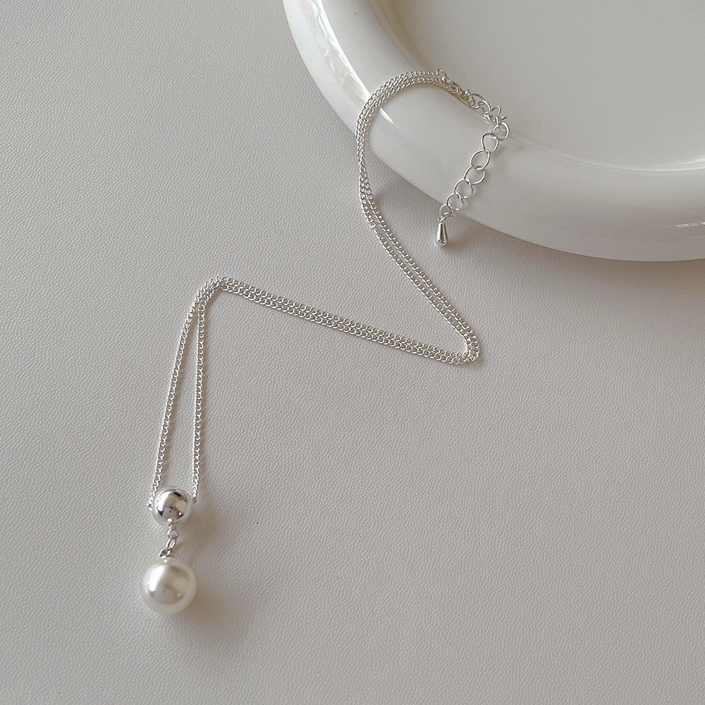 Full silver-tone faux pearl pendant necklace showing chain, clasp, and extender