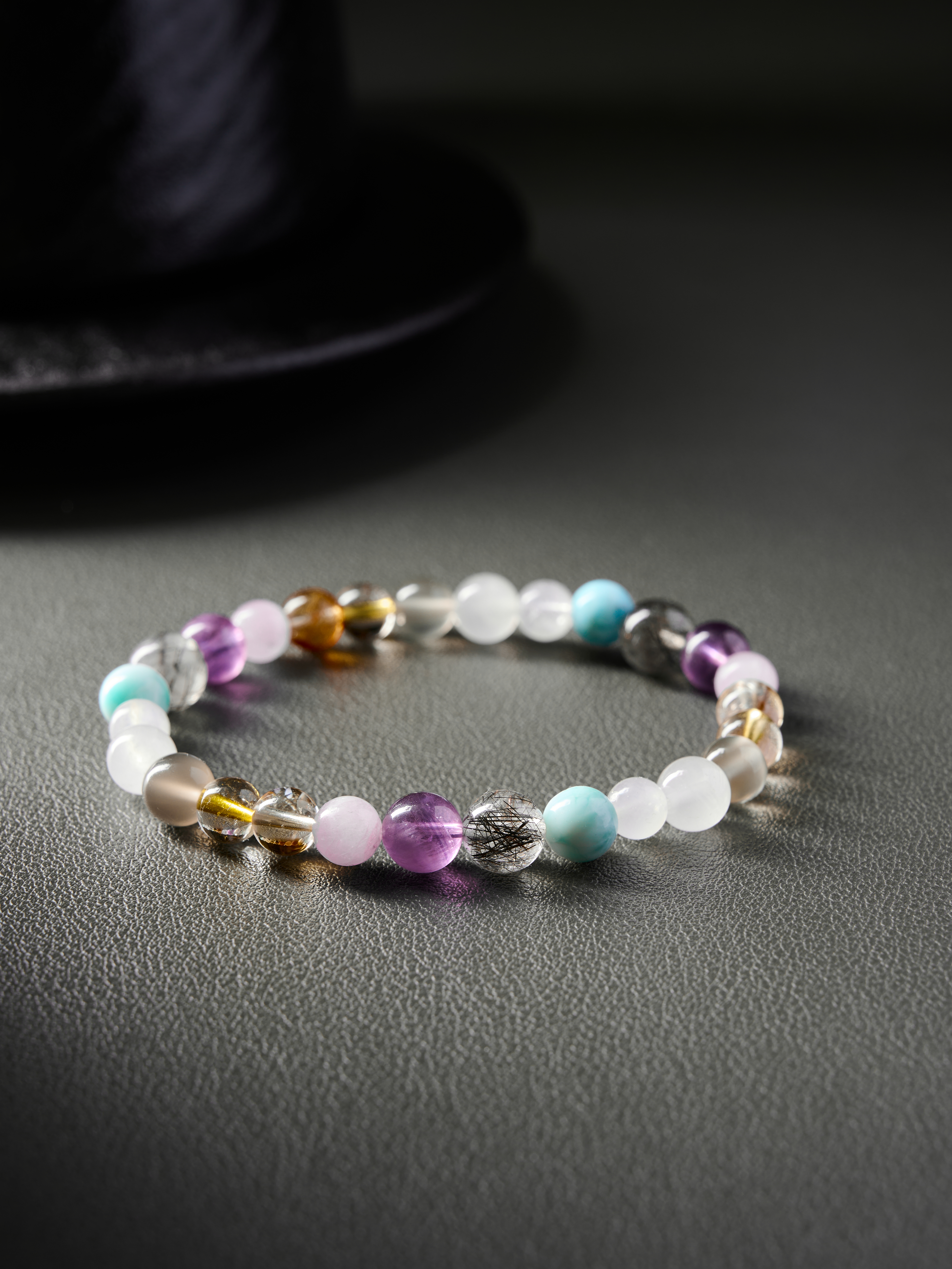 Close flat lay emphasizing color harmony—lilac, sky blue, honey gold and translucent white tones
