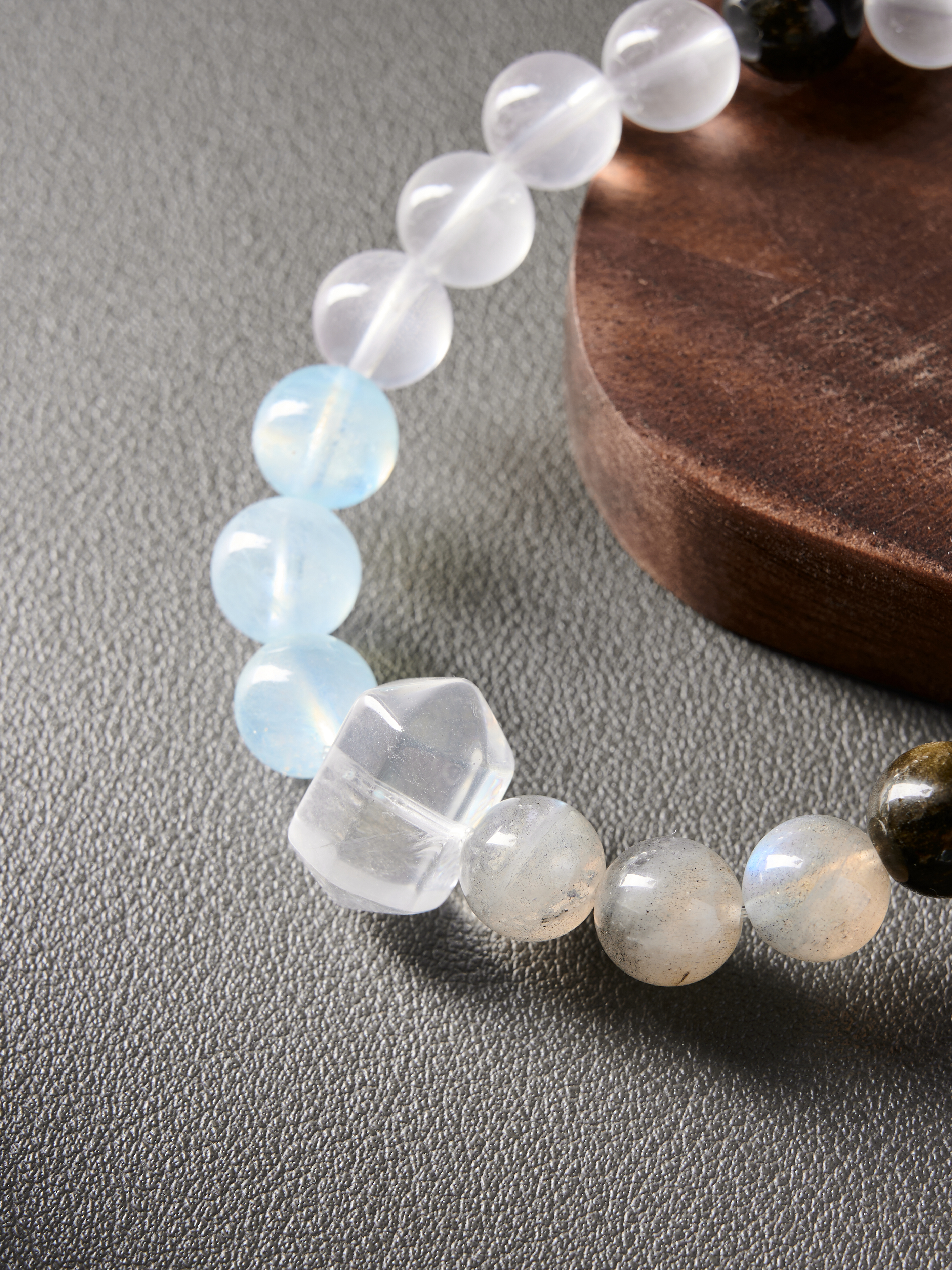 Macro side profile highlighting natural inclusions in moonstone and obsidian beads, fits 16–18 cm wrists