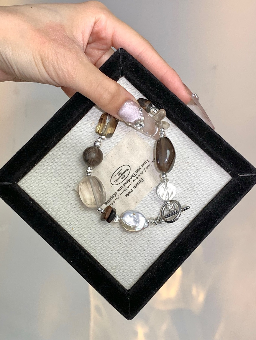 Bracelet displayed in black velvet jewelry box close-up