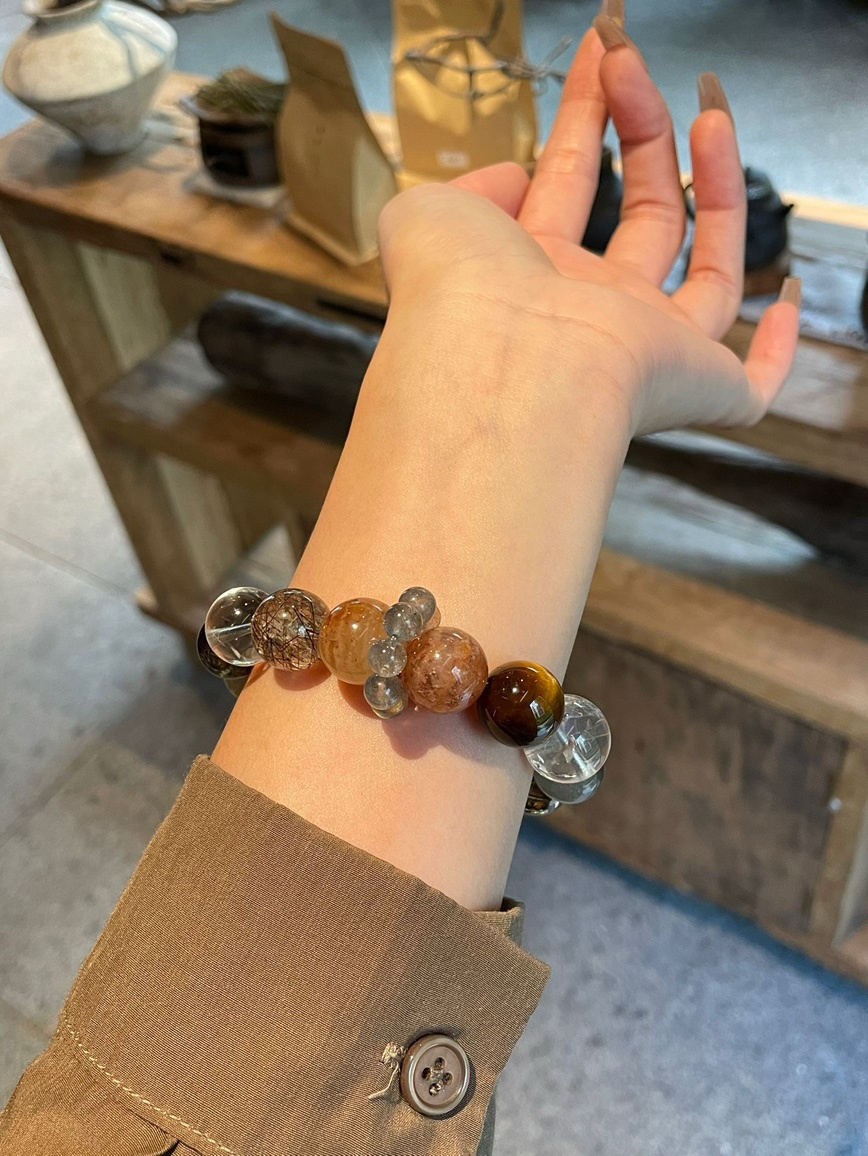 Wrist wearing Tiger’s Eye and Black Rutilated Quartz bracelet